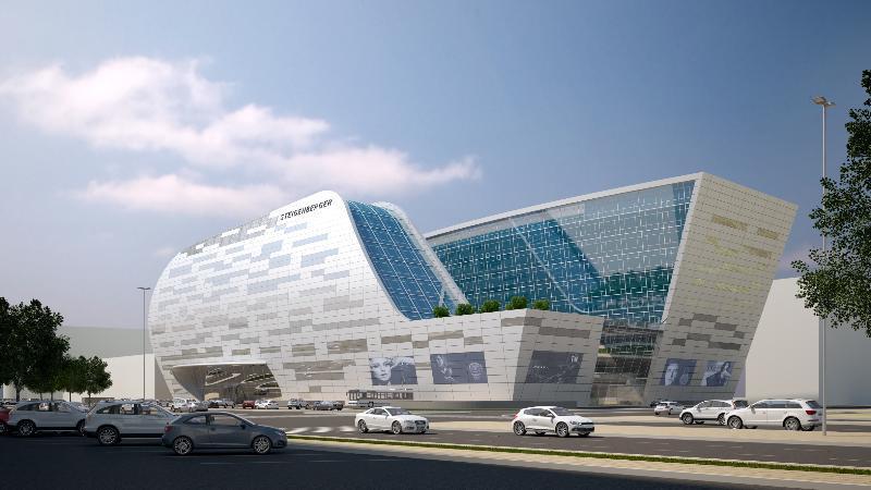 Steigenberger Hotel Doha Exterior photo The image shows a modern architectural building with a futuristic design. The structure features large glass windows and a dynamic, flowing shape, combining different materials like metal and stone. There are green areas on the roof, and several scre